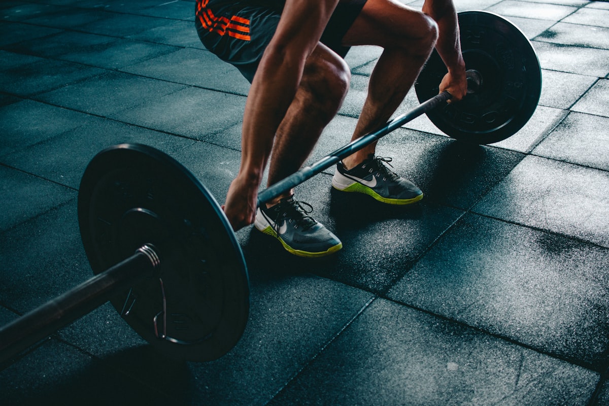 Athlete performing a heavy barbell lift in the gym